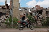 Zničené budovy v ukrajinské Popasaně