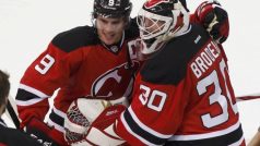 New Jersey Devils goalie Martin Brodeur (R) is congratulated by Zach Parise after the Devils defeated the New York Rangers in Game 4 of their NHL Eastern Conference Final hockey playoff game in Newark, New Jersey May 21, 2012